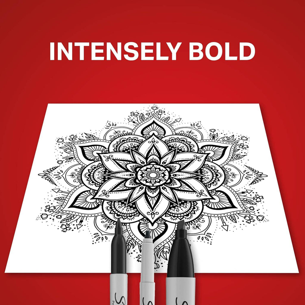 Permanent markers with black tips placed on a white sheet with floral pattern