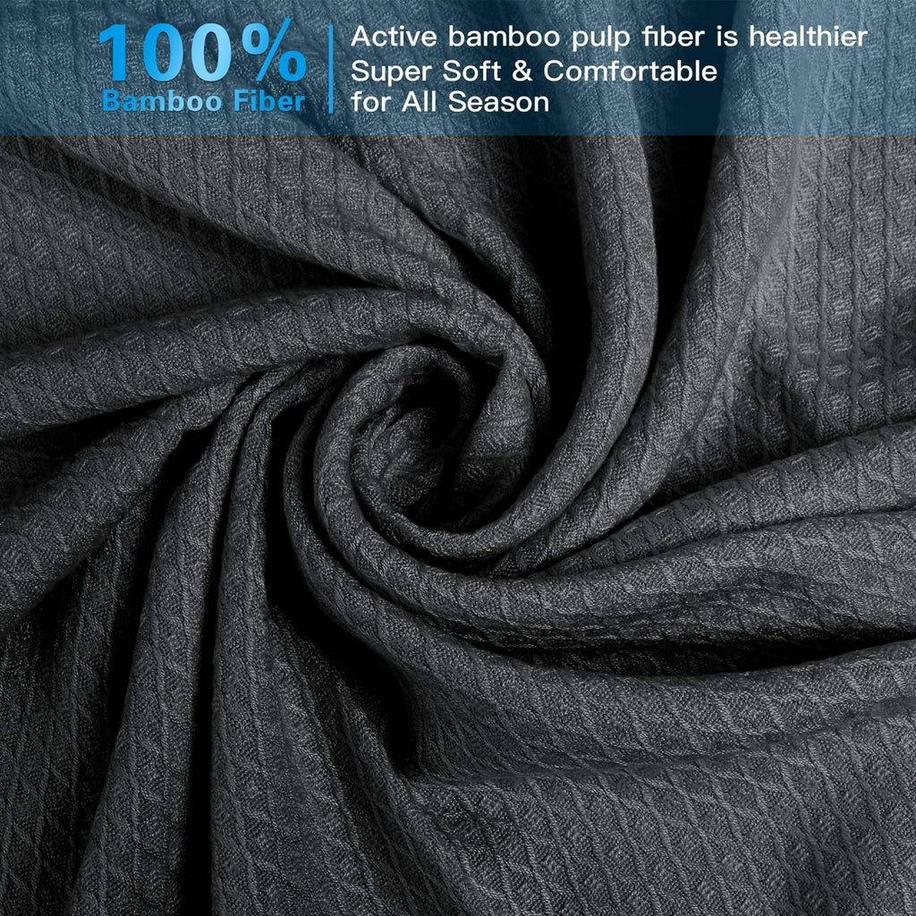 Dark gray cooling blanket fabric close-up with textured knit pattern