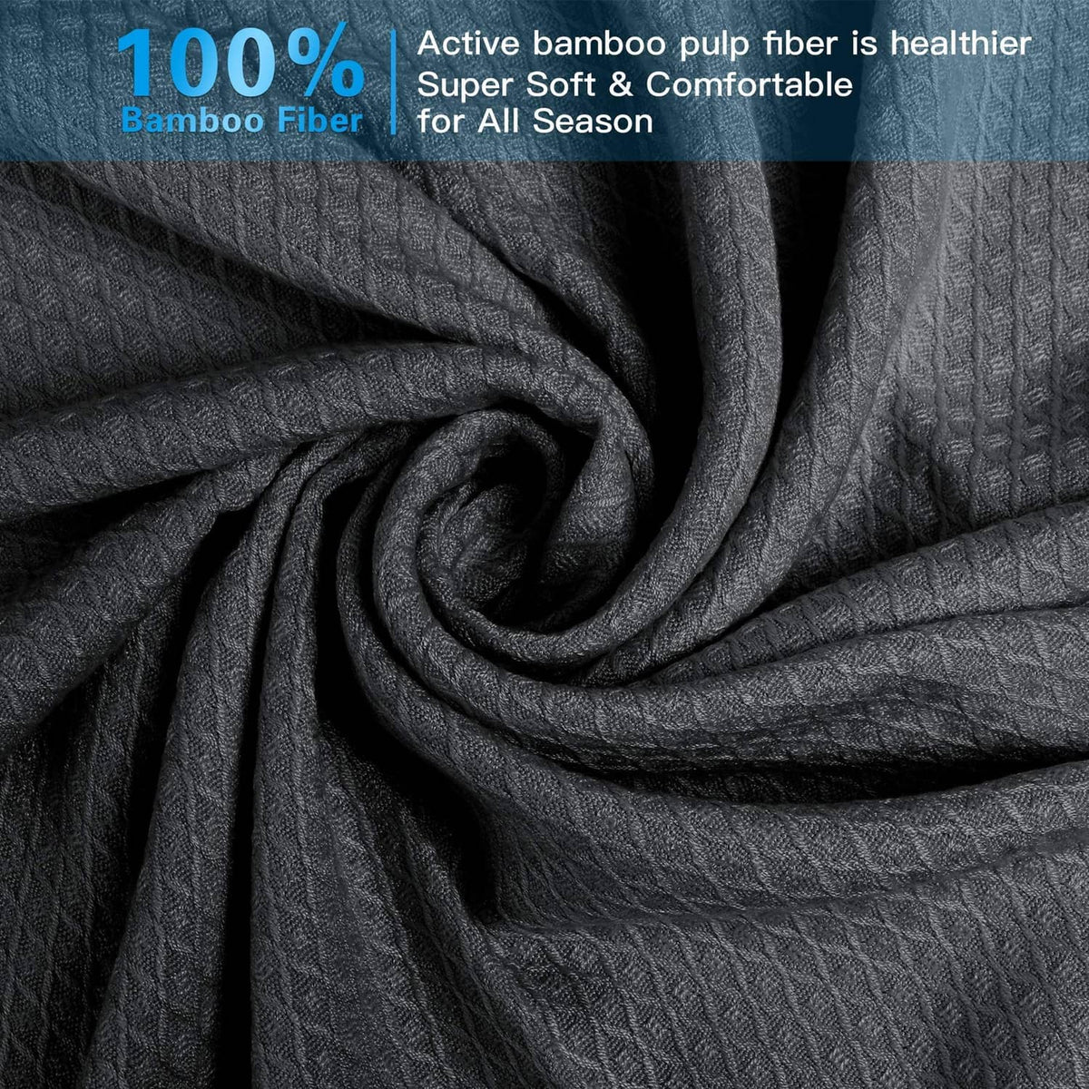 Dark gray cooling blanket fabric close-up with textured knit pattern
