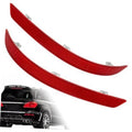 Pair of red rear bumper reflectors with textured surface and mounting tabs