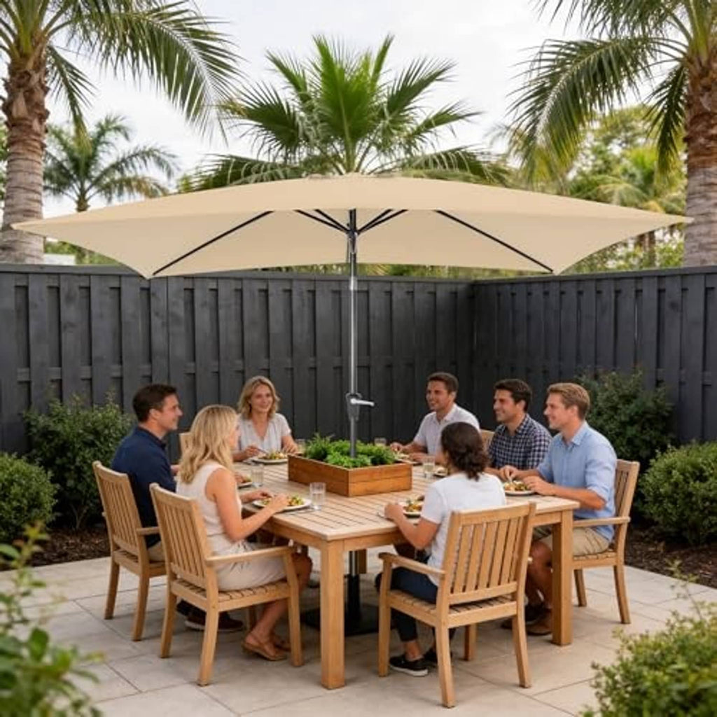 Beige rectangular patio umbrella with black center pole over outdoor dining area