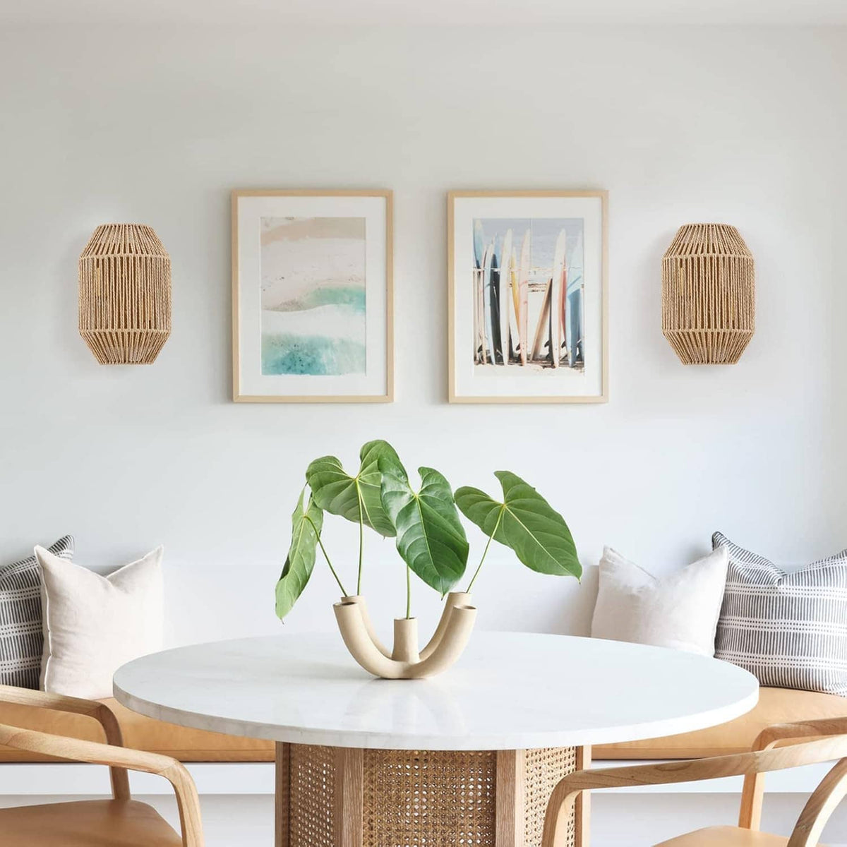 Two woven rattan wall sconces with warm brass-toned mounting hardware