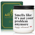 Creamy white soy wax candle jar with black lid in front of green “ARLY” gift box.