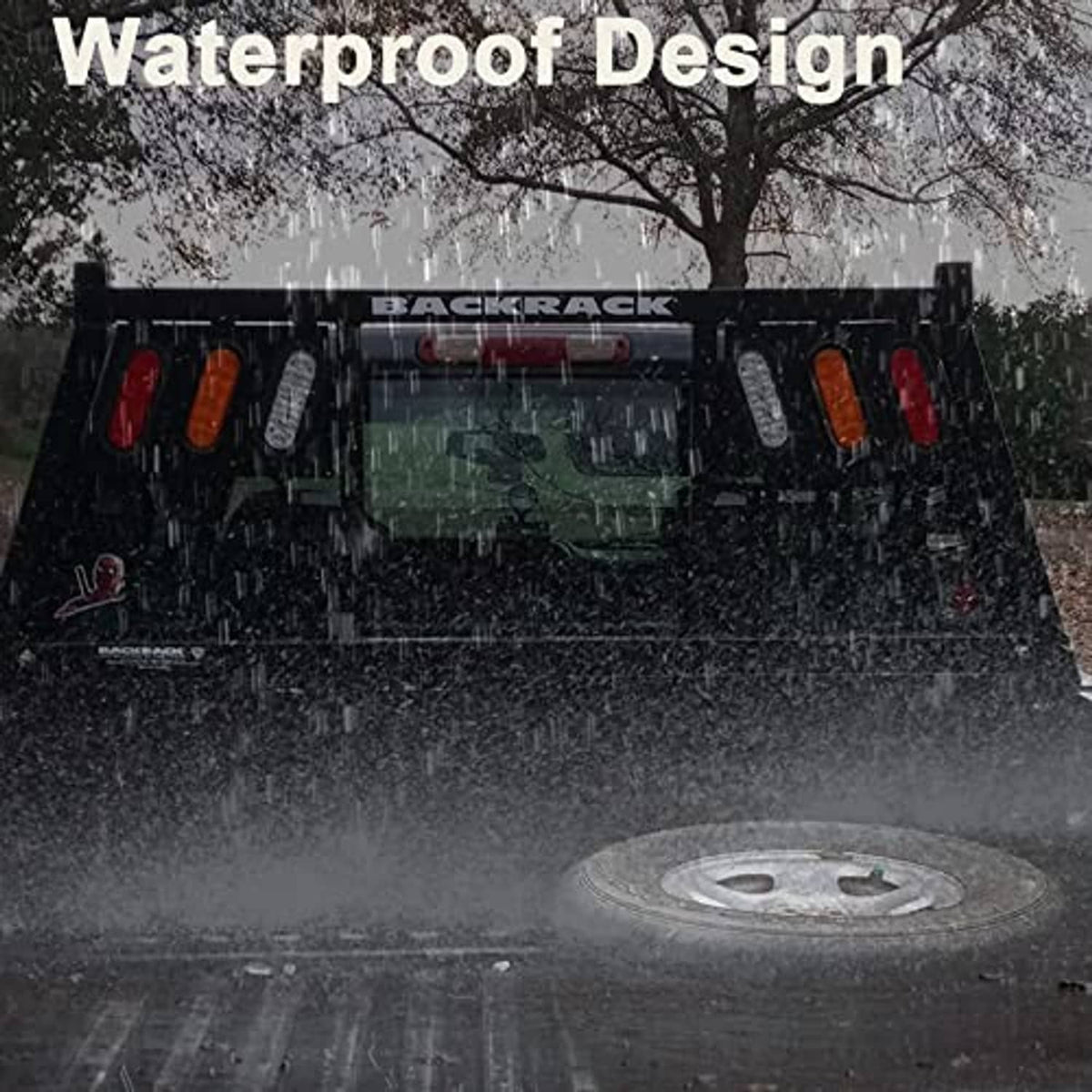 Oval LED trailer tail lights set installed with red lenses visible in rainy conditions.