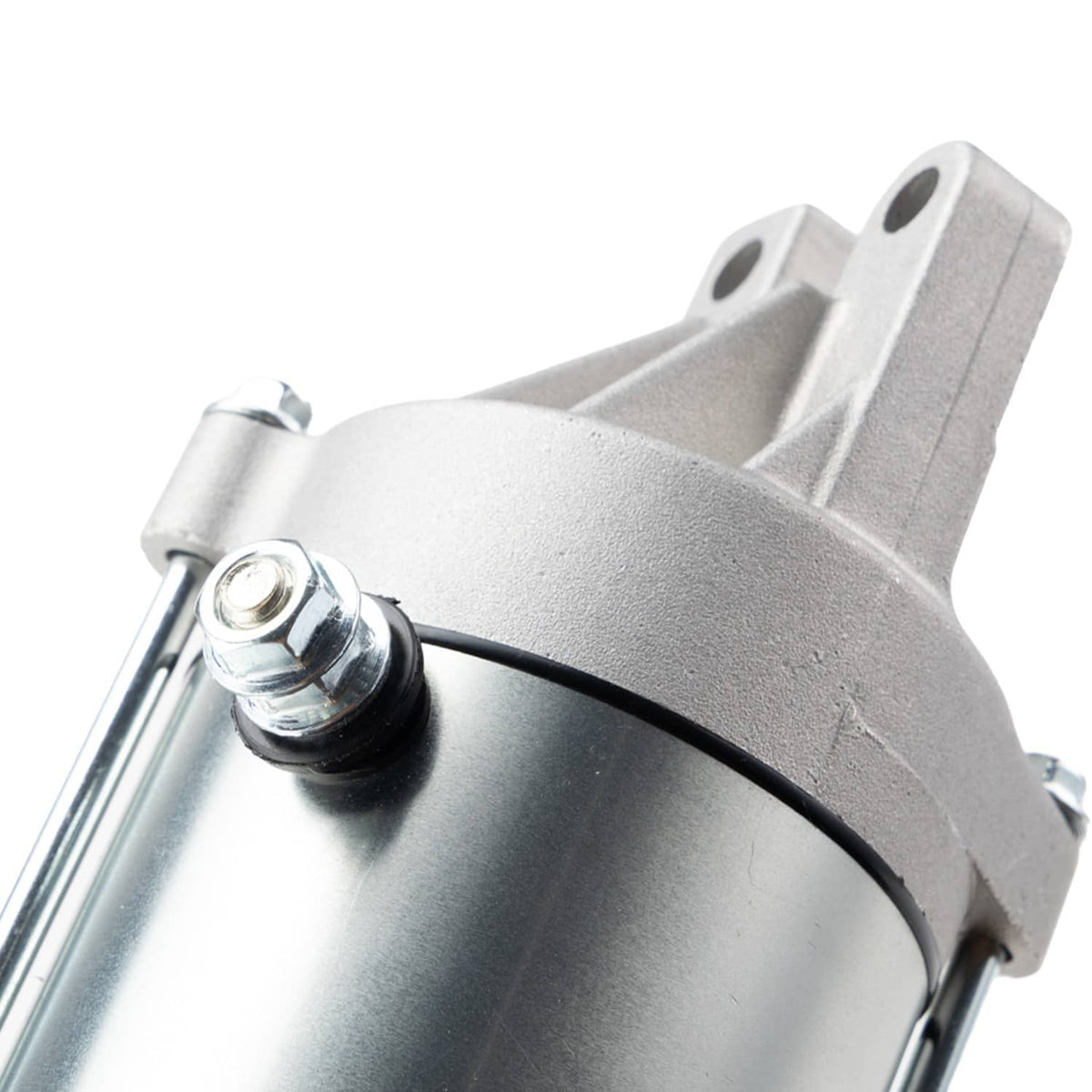 Starter motor assembly close-up of housing edge and black cable loop