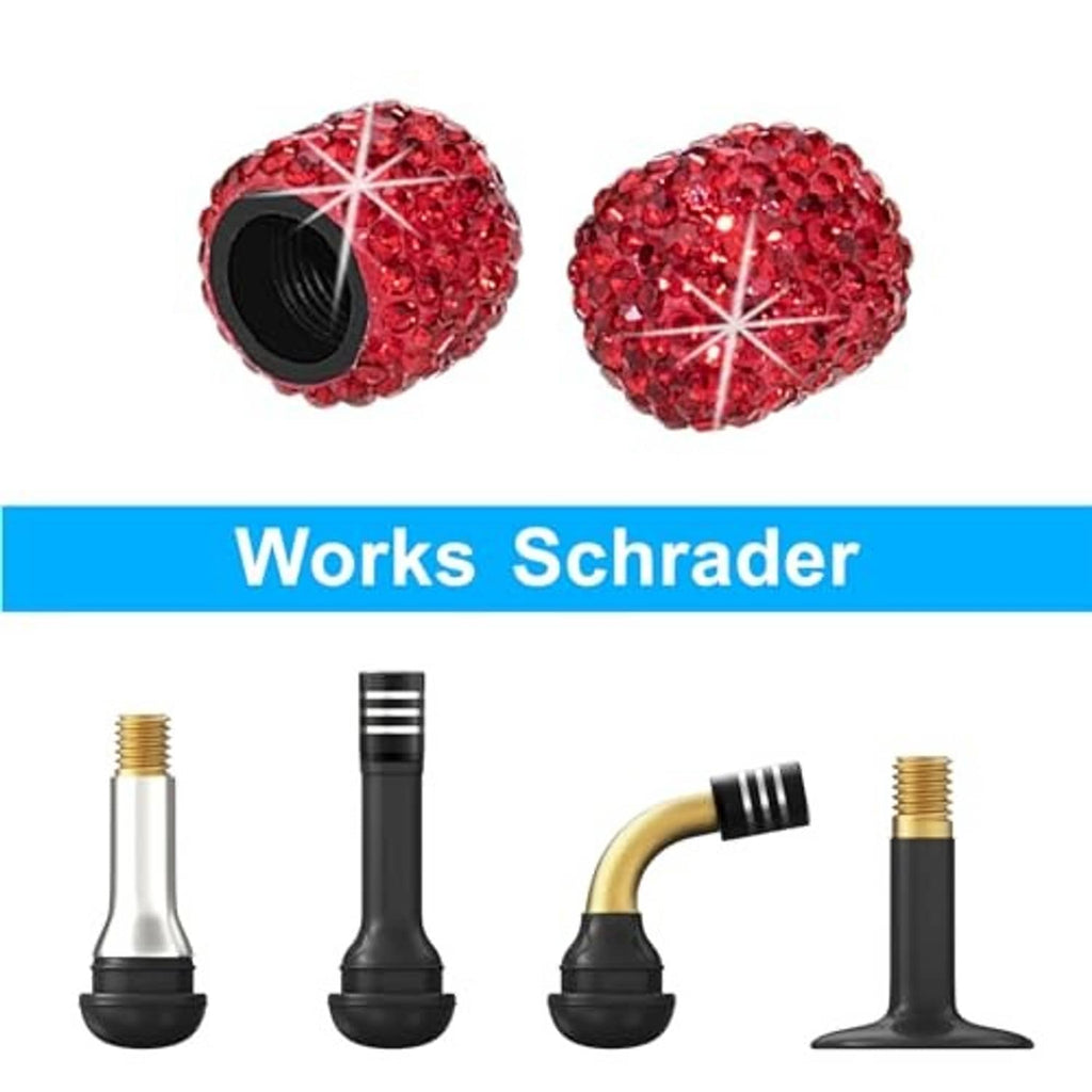 Pair of red rhinestone tire valve stem caps with silver starburst spokes and black insert