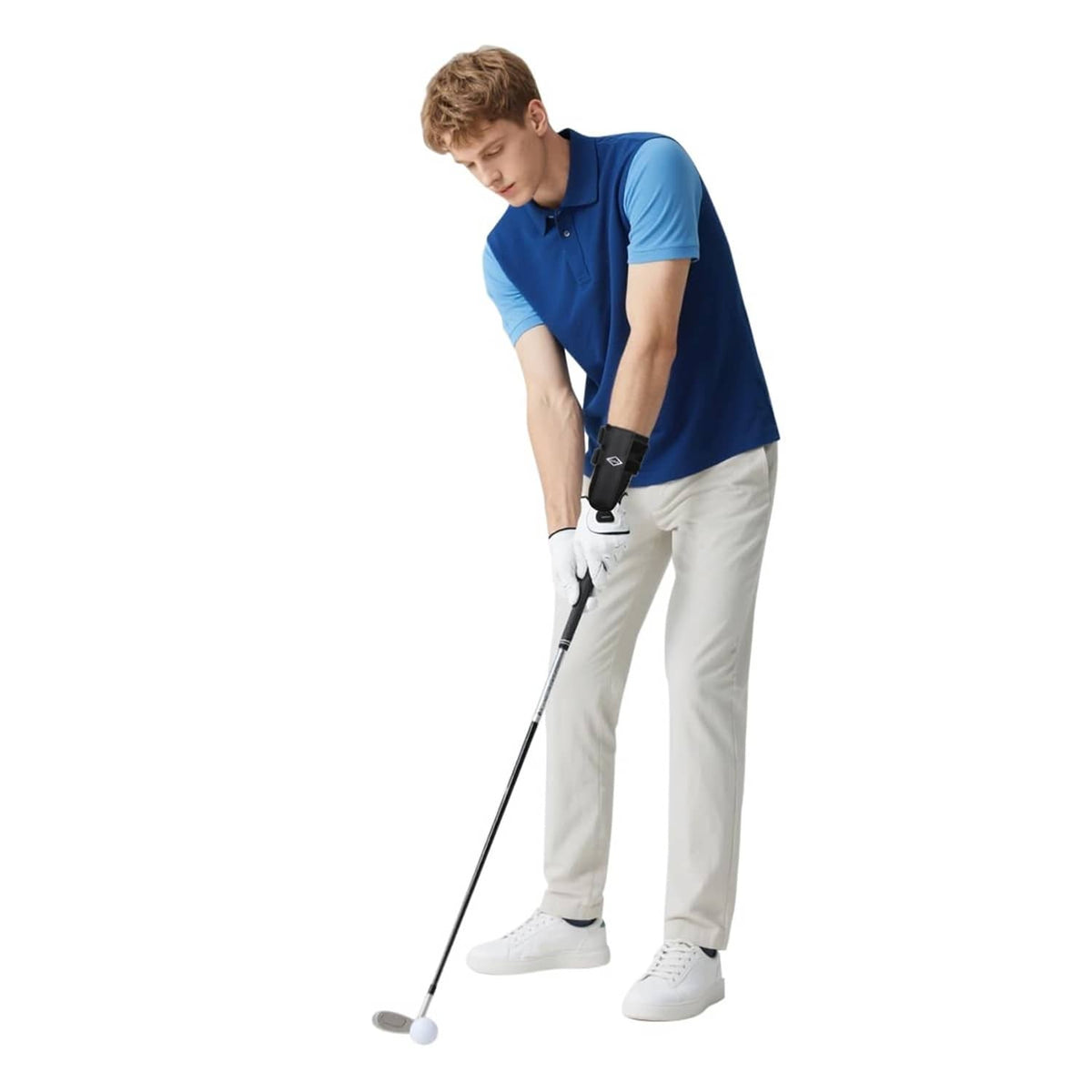 Black wrist brace worn on golfer's lead wrist with side straps