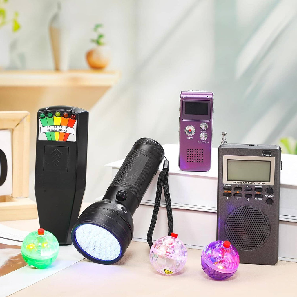 Paranormal EMF detector set with purple recorder, black EMF meter, UV flashlight, and orbs