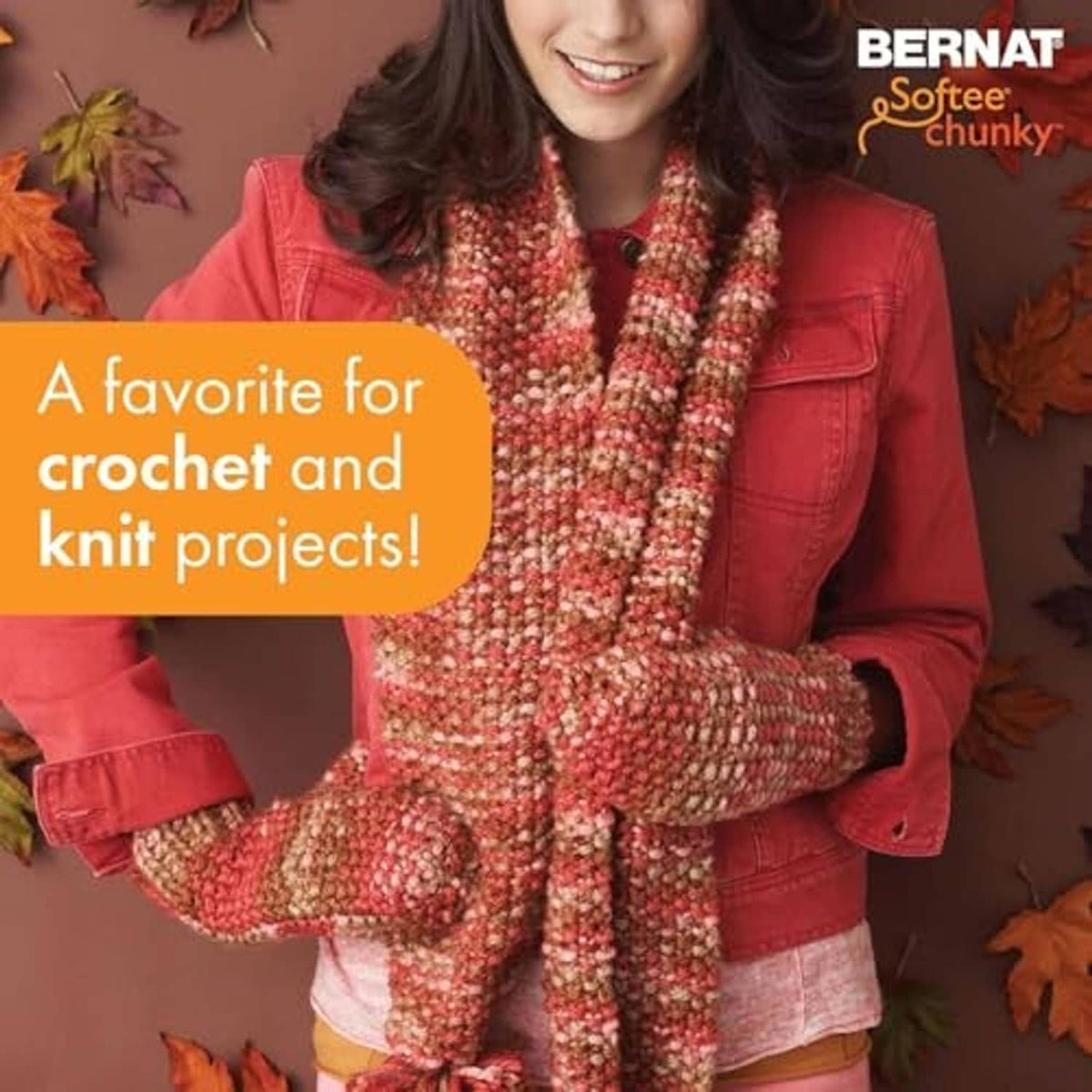 Multicolor bulky knit scarf with thick texture, worn with a red jacket.