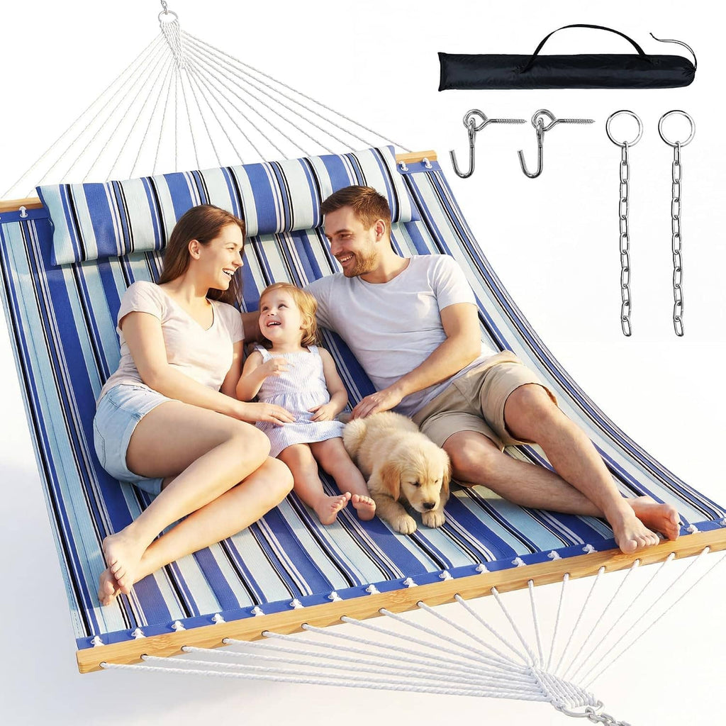 Striped patio hammock with spreader bar, blue-and-white fabric, with wooden spreader