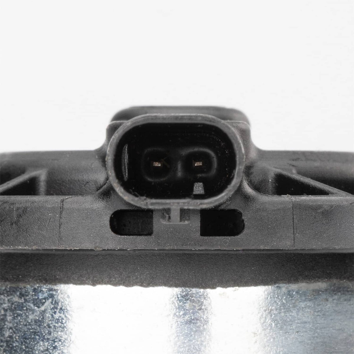 Electrical connector on camshaft phaser actuator, two-pin plug on black housing