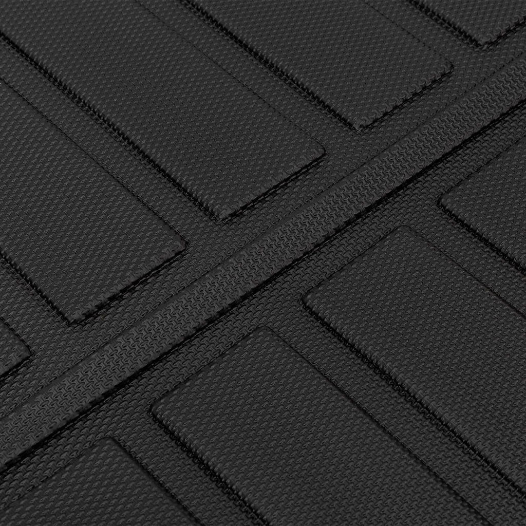 Close-up of black TPE cargo liner tread with textured diagonal grooves