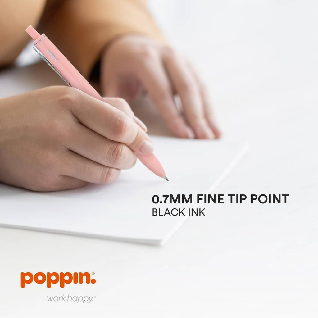 Hand writing with a blush pink retractable gel pen, 0.7 mm fine tip