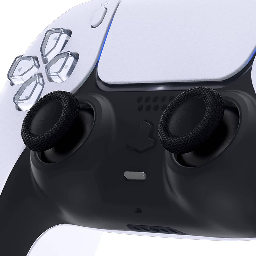 Two black thumbstick caps installed on PS5 controller analog sticks, textured grips