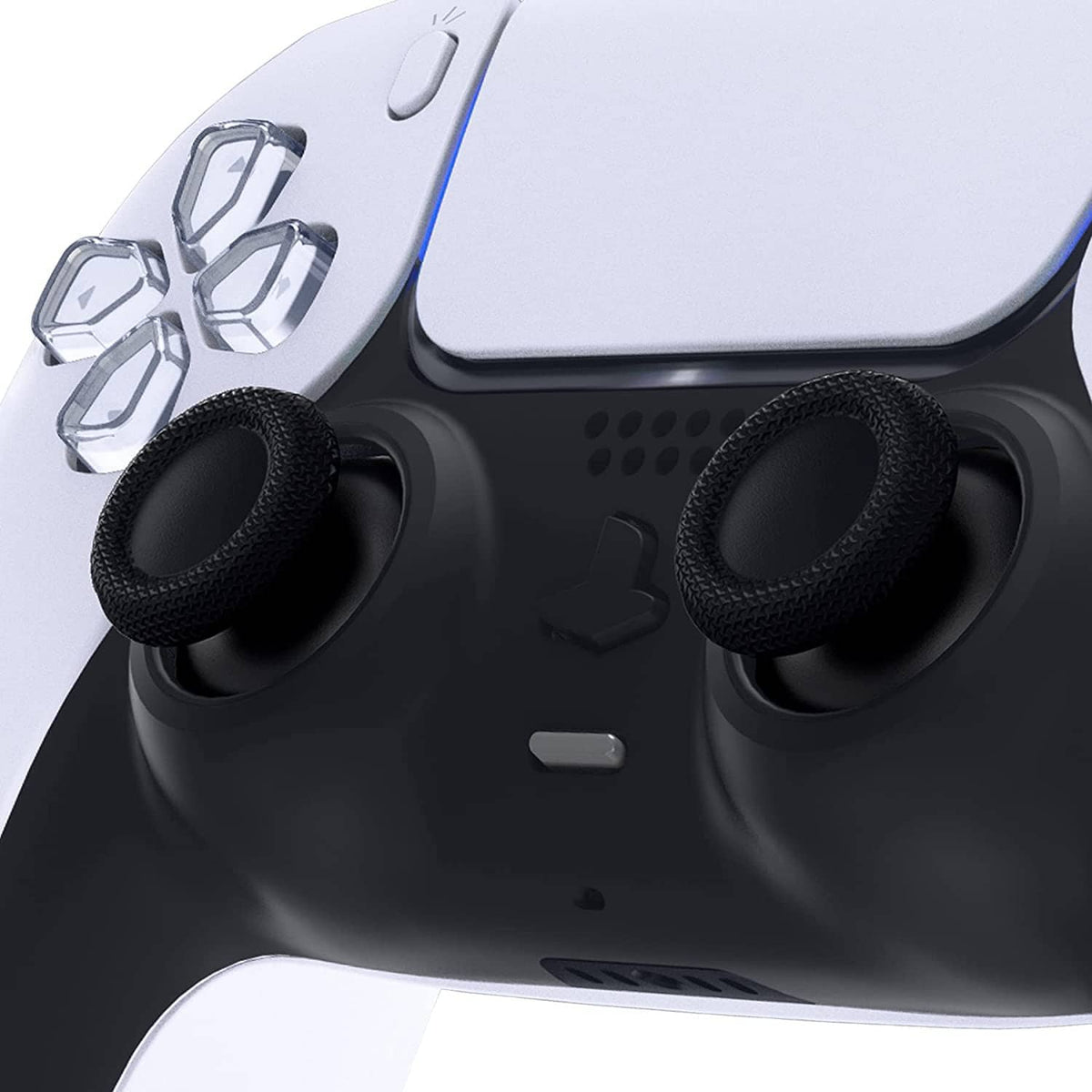 Two black thumbstick caps installed on PS5 controller analog sticks, textured grips