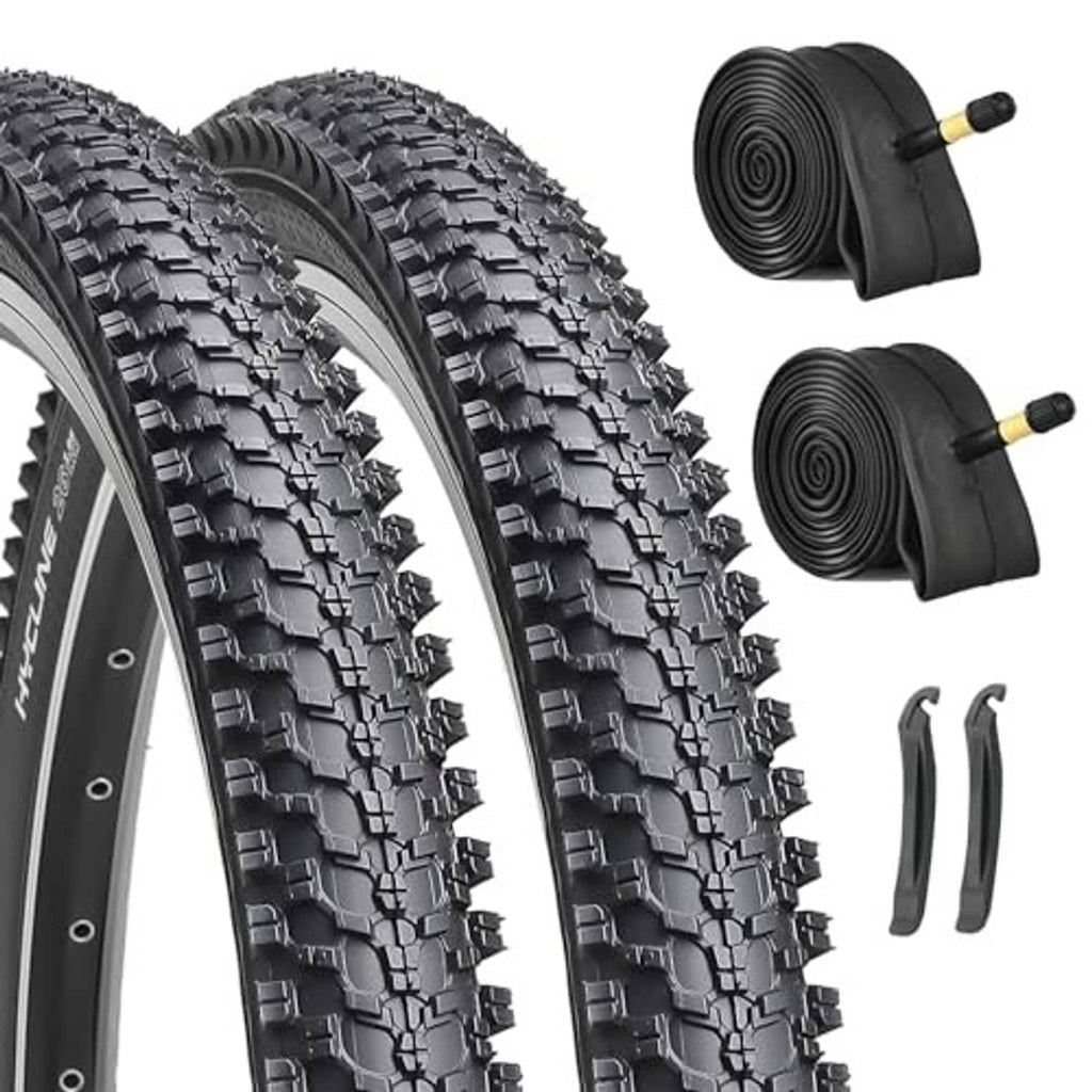 Mountain bike tire set with deep black tread plus two rolled inner tubes and levers.