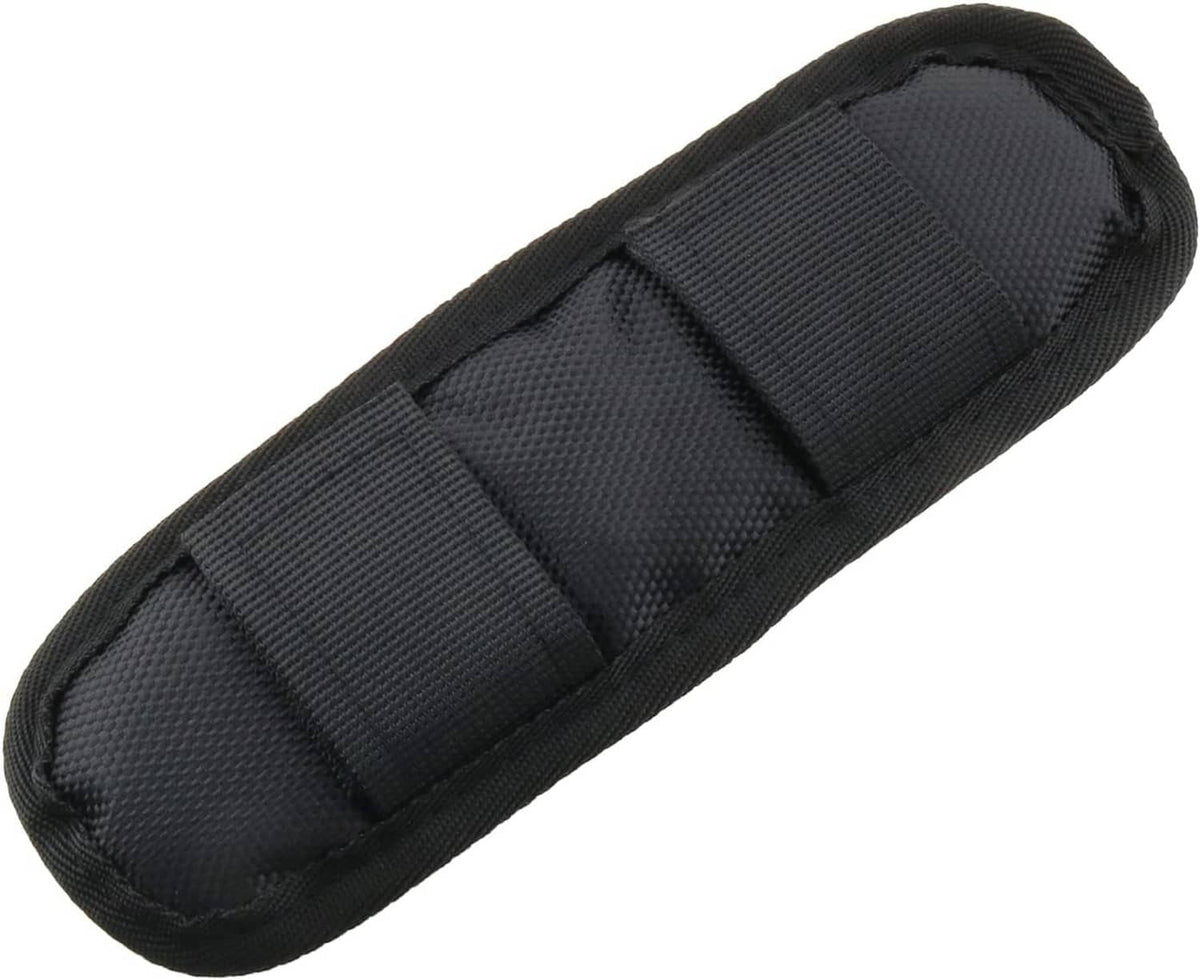 Black removable luggage shoulder strap pad, padded with stitched segments and textured fabric