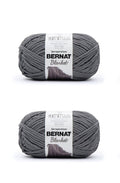 Super bulky blanket yarn skein, dark gray; two wrapped balls shown together