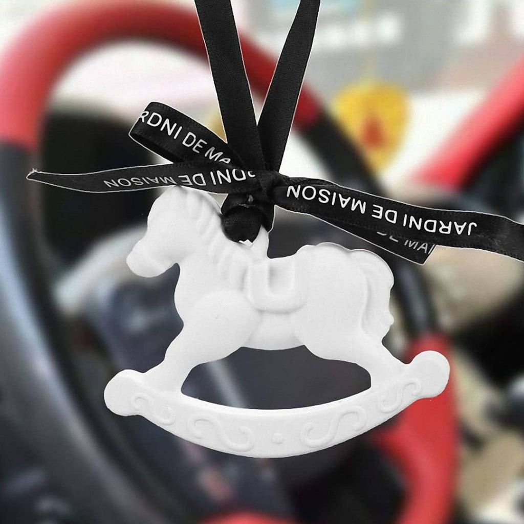 White rocking horse silicone mold with tied black ribbon, close-up.