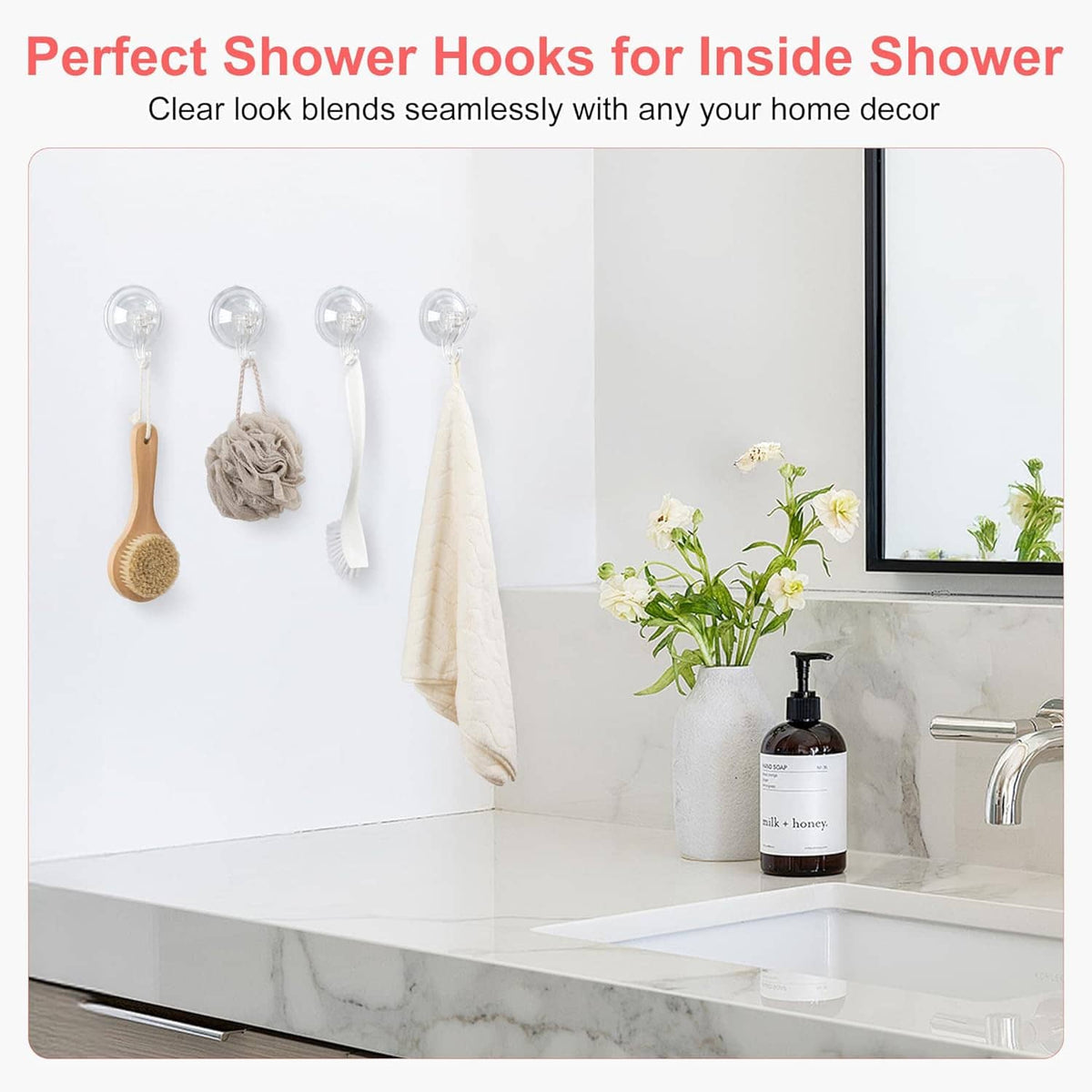 Transparent suction cup shower hooks holding towel and bath items inside shower