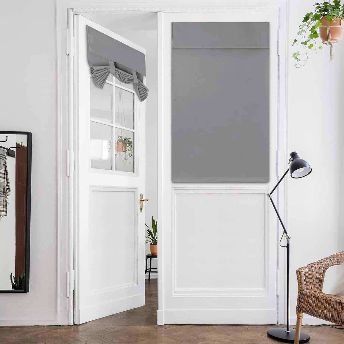 Light grey blackout door window curtain panel on a French door window opening