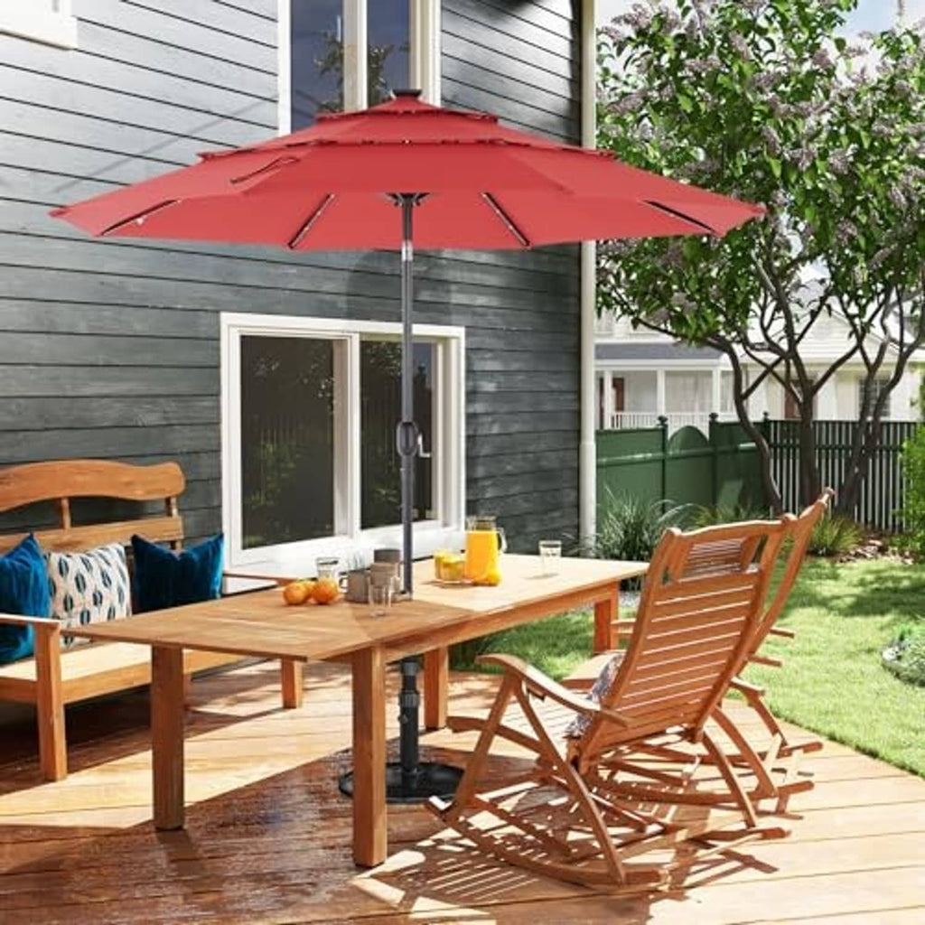 Crimson outdoor 3-tier patio umbrella with LED string lights above patio seating table