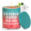 Scented candle with teal lid, pink wax and white floral topper