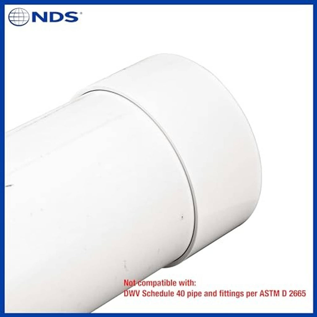 White 6-inch PVC S&D end cap on pipe stub, close-up angle
