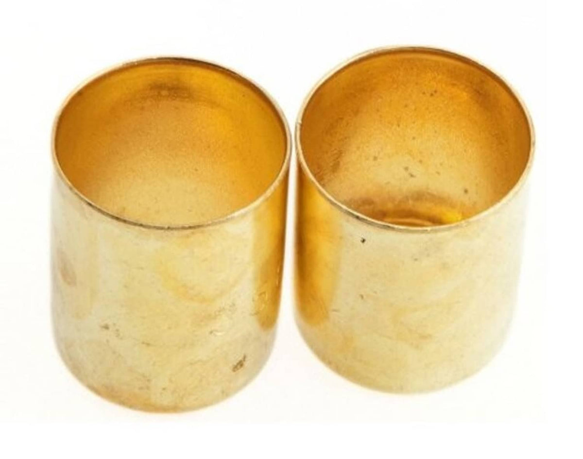Two brass hose splicer sleeves, open ends facing up