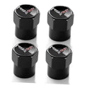 Black metal tire valve stem caps, four-pack, with Corvette emblem on top.