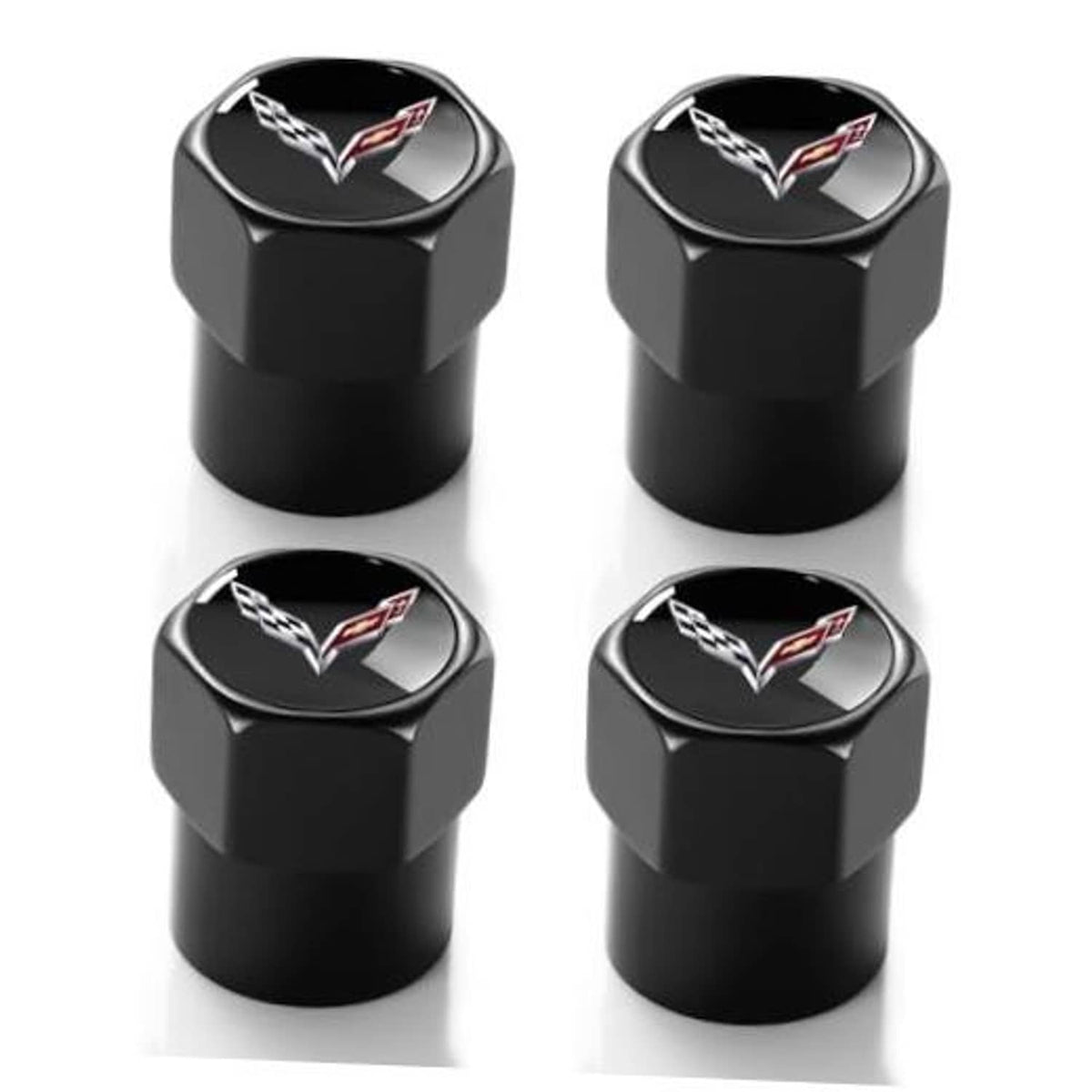 Black metal tire valve stem caps, four-pack, with Corvette emblem on top.