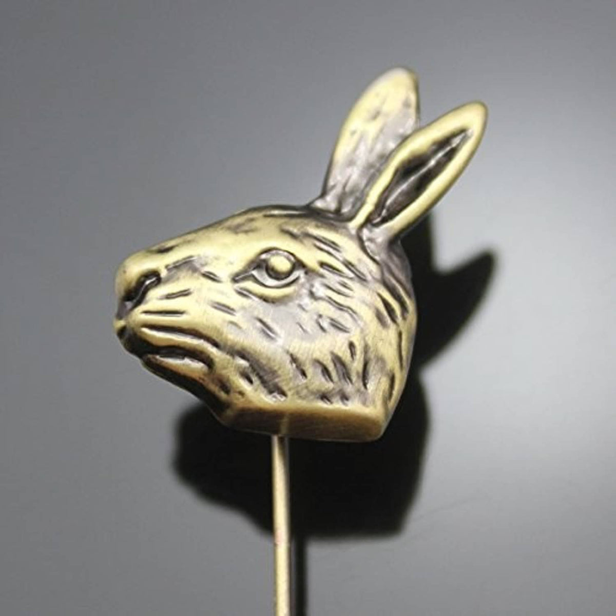 Gold-tone rabbit head hatpin, close-up with facial details