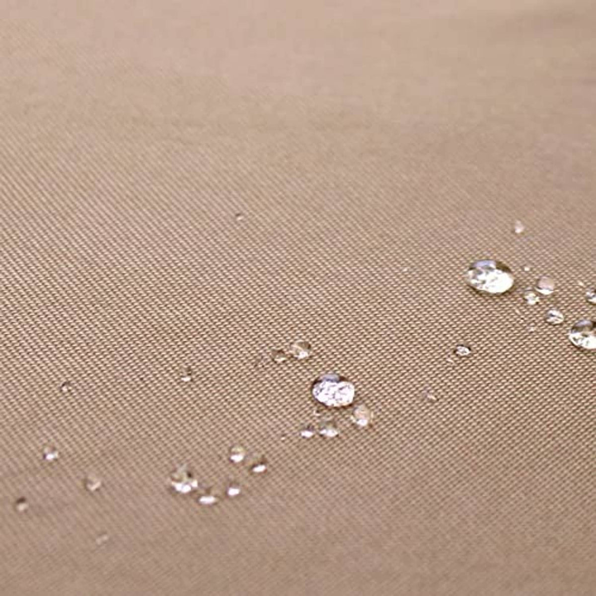 Brown AC cover fabric with water droplets beading on the surface