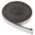 Graphite fiberglass stove gasket roll with trailing strip, dark gray braided texture