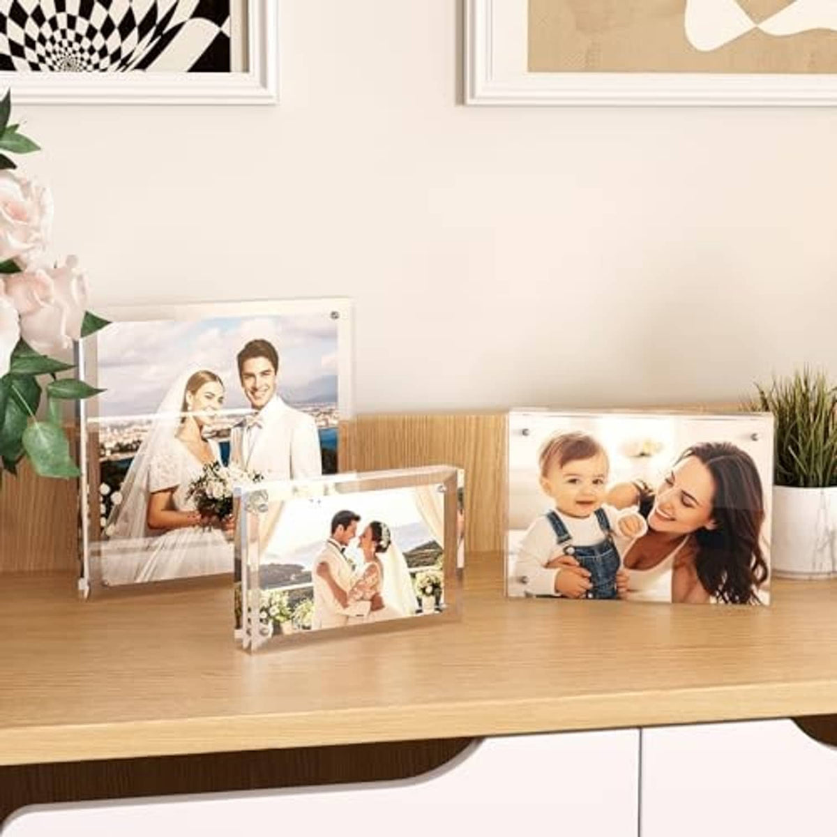 Set of clear acrylic frameless 5x7 photo frames on tabletop, multiple photos displayed