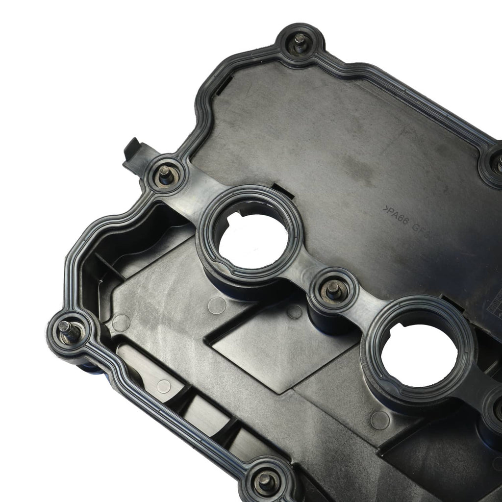 Valve cover underside with two circular openings and stamped metal surface
