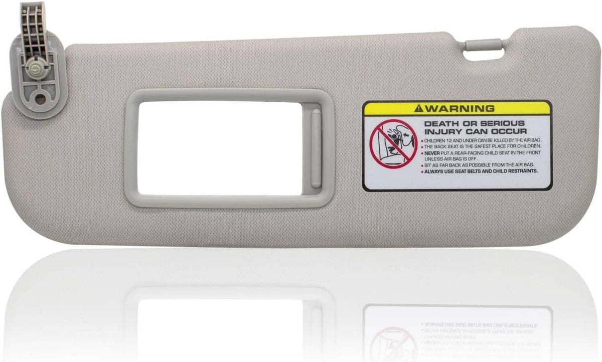 Gray driver-side sun visor with vanity mirror panel and mounting clip
