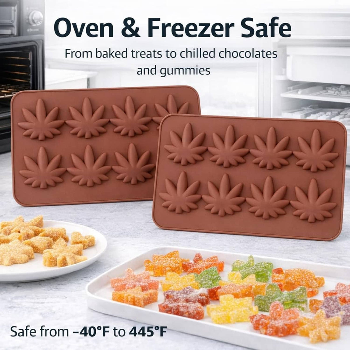 Two brown silicone candy mold trays with raised maple leaf pattern