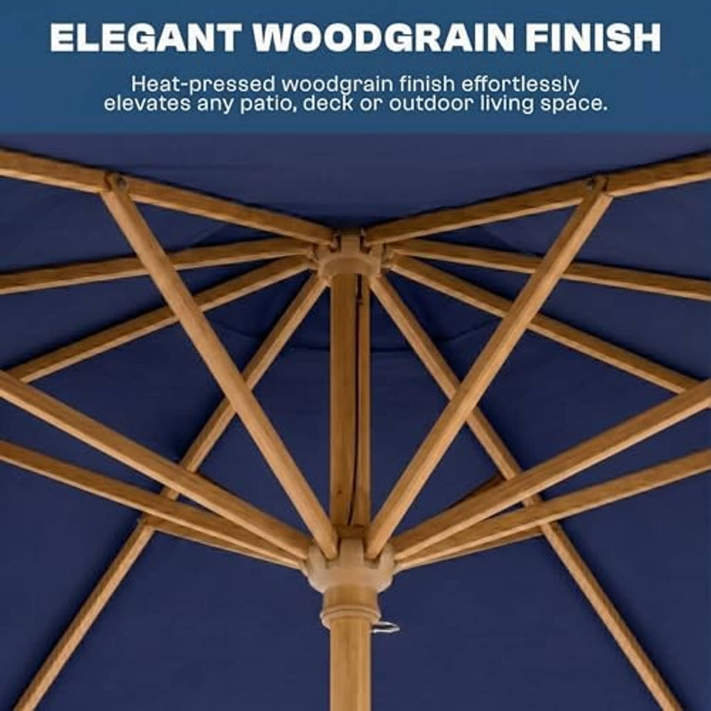 Close-up of navy umbrella canopy with wooden rib frame and central hub