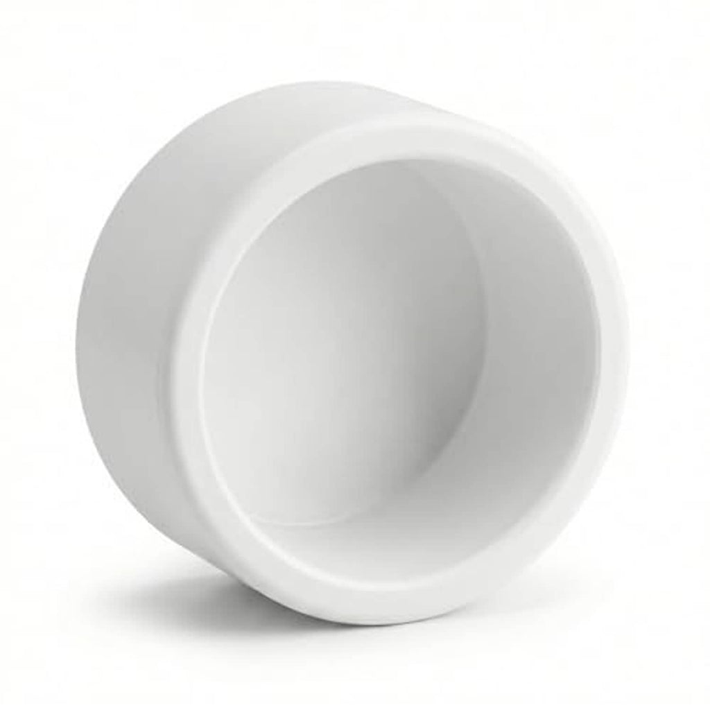 White PVC 1/2 inch pipe end cap plug with visible inner cavity