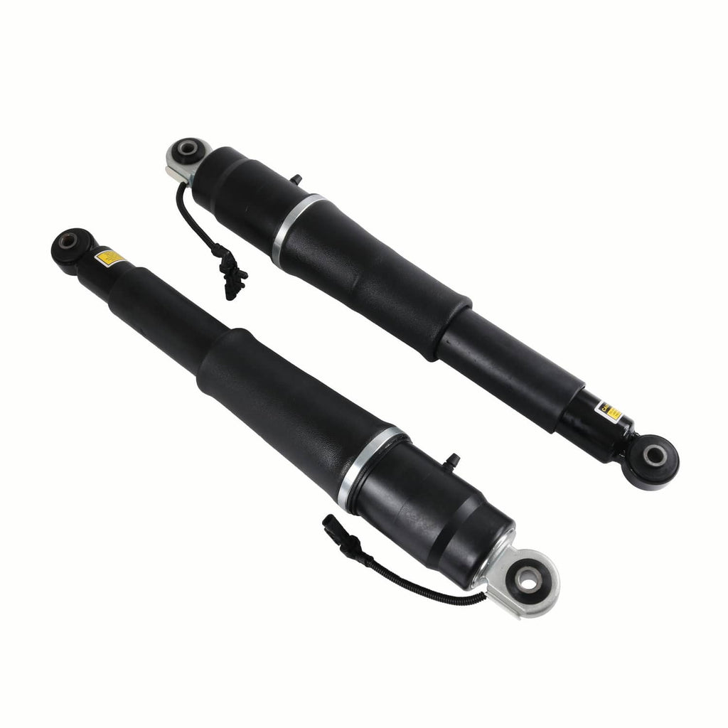 Pair black rear air shocks with top caps, bottom eyelet mounts, and attached cables