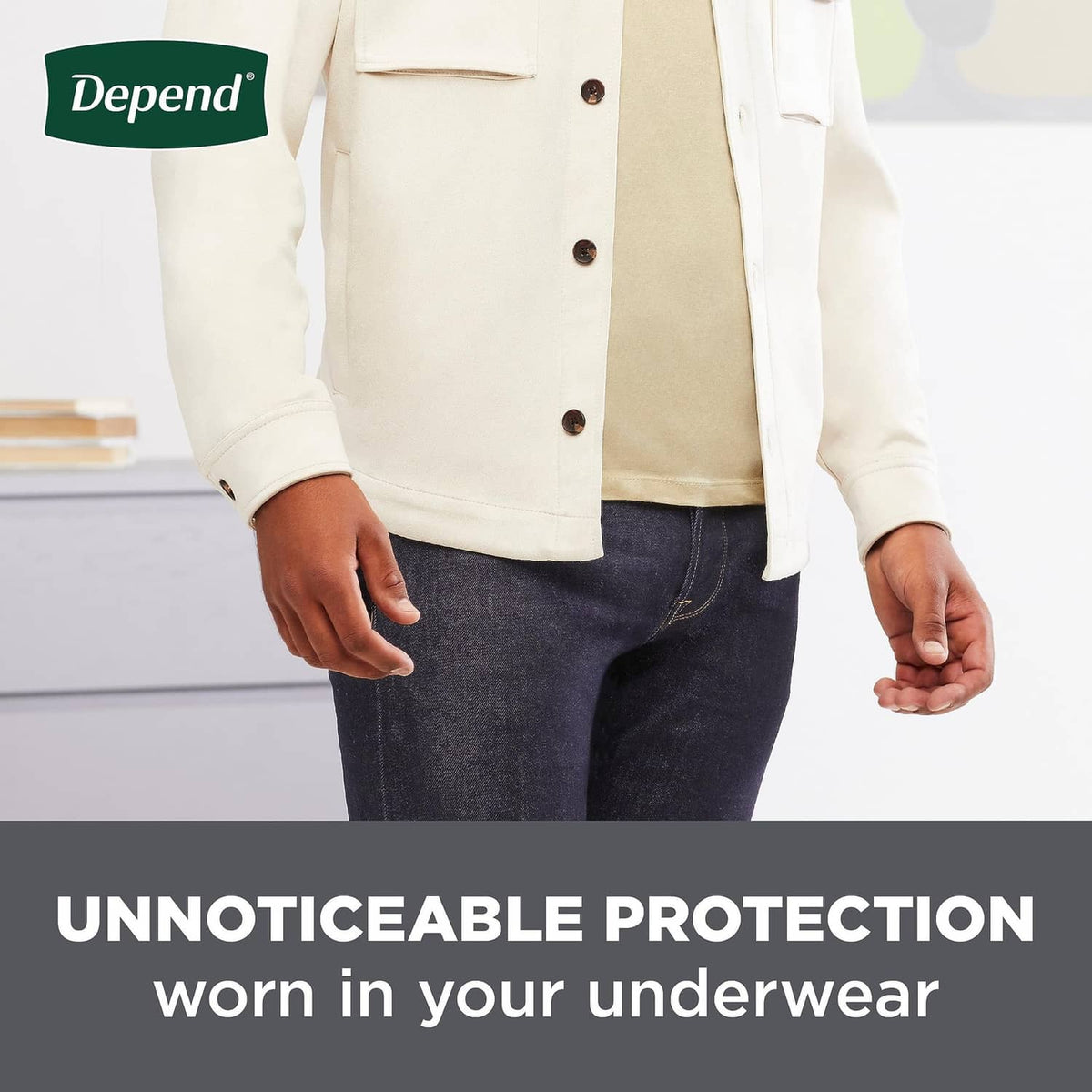 Man standing with jeans, protective guards worn underneath for discreet bladder control