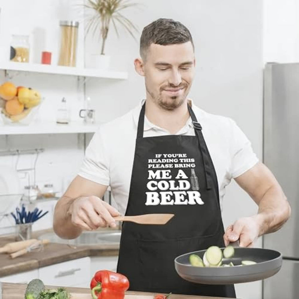 Black kitchen apron with 'me a cold beer' slogan and two front pockets