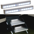 Two long LED light bars with built-in motion sensor, mounted under cabinet shelves