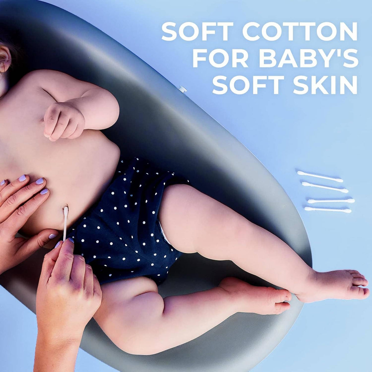 Cotton swabs used for baby skin care, swab tip held near infant