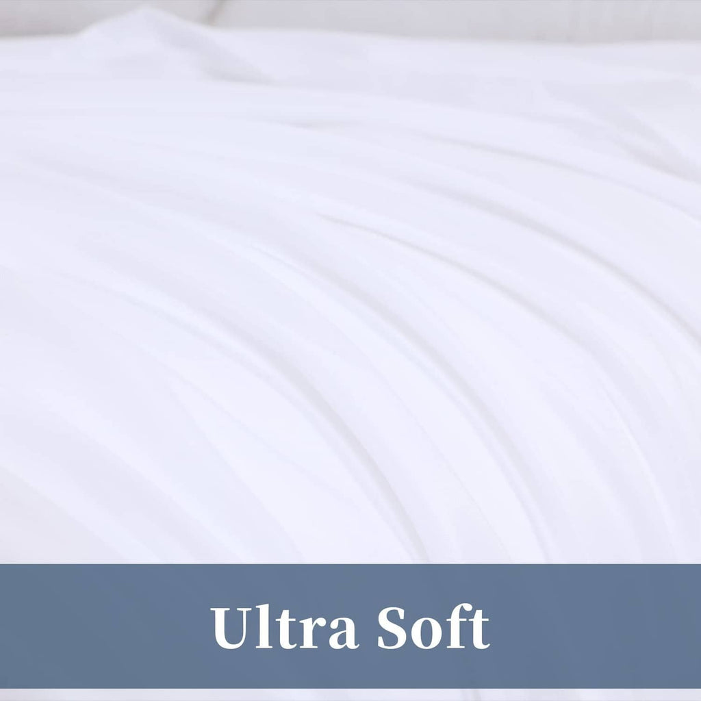 White flat sheet close-up showing smooth fabric with gathered folds