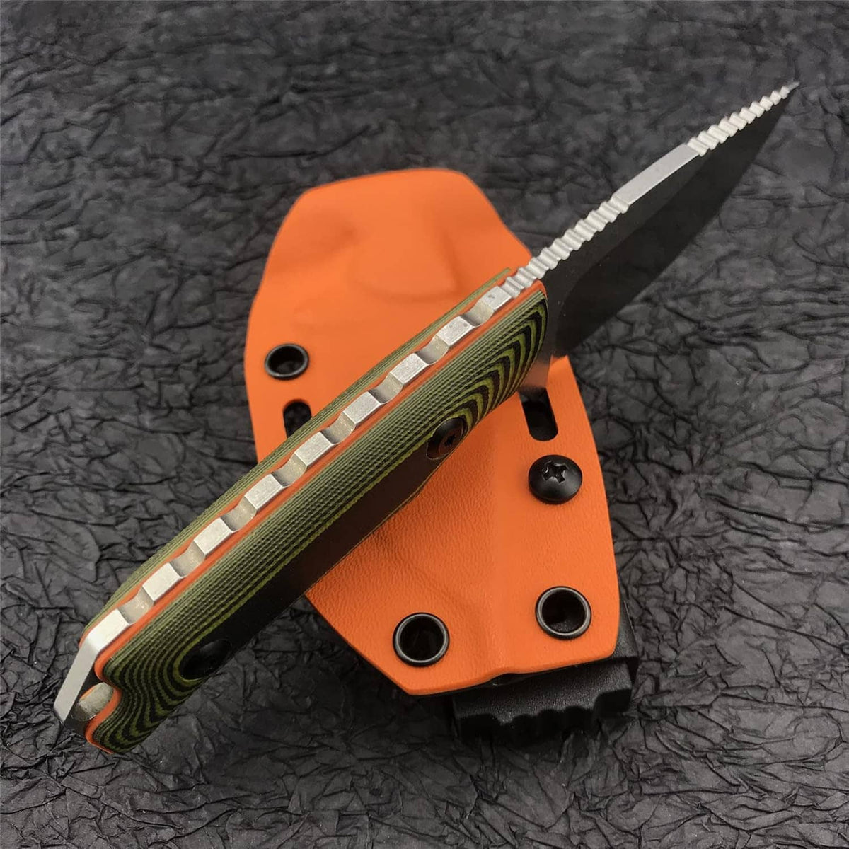 Fixed blade knife with orange Kydex sheath and green handle, blade angled with liner