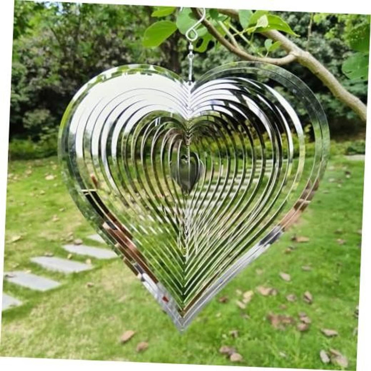 Heart-shaped hanging wind spinner with silver and dark reflective metal spirals