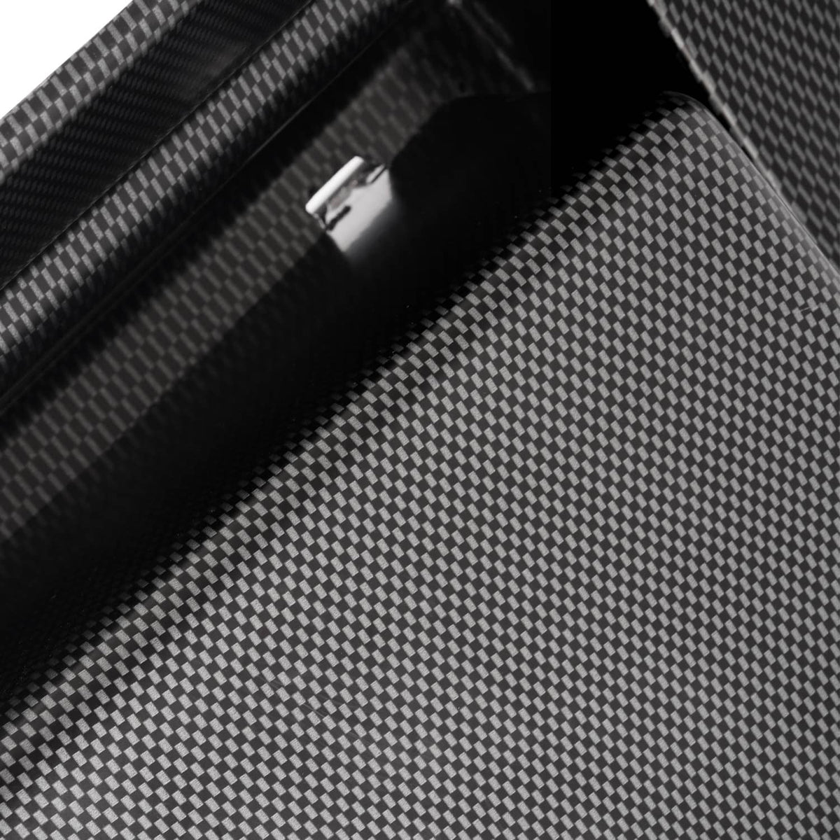 Close-up of carbon-fiber dash cover with a narrow channel and deep interior recess.