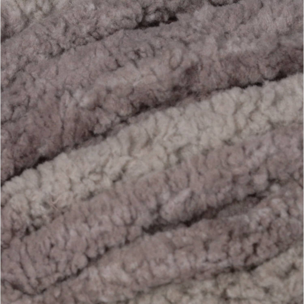 Chenille yarn texture close-up with dark gray rows and lighter stripe bands